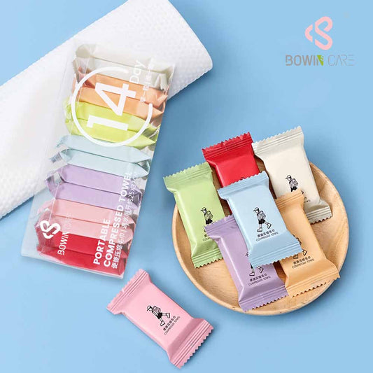 14-pcs 7-color travel disposable magic compressed coin towels, manufactured by Little Cotton OEM factory.