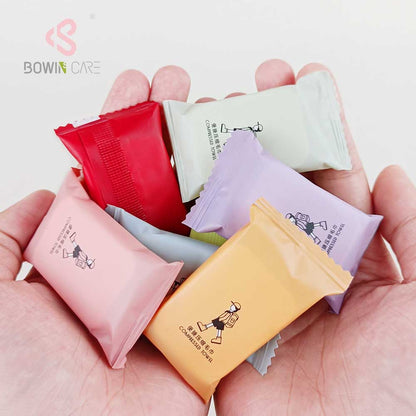 14-pcs 7-color travel disposable magic compressed coin towels, manufactured by Little Cotton OEM factory.