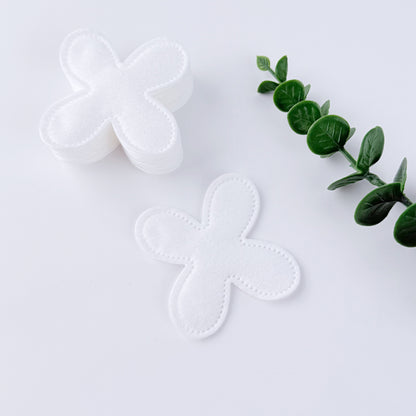 Flower-shaped pressed-edge cotton pads on a wooden tray – Little Cotton OEM