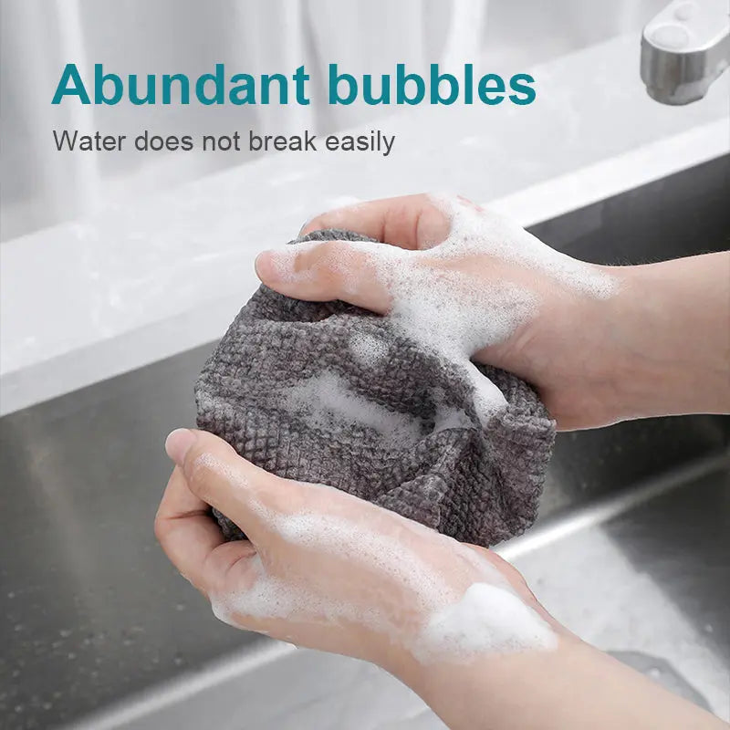 Highly absorbent oil resistant nonwoven cleaning wipes for commercial kitchens
