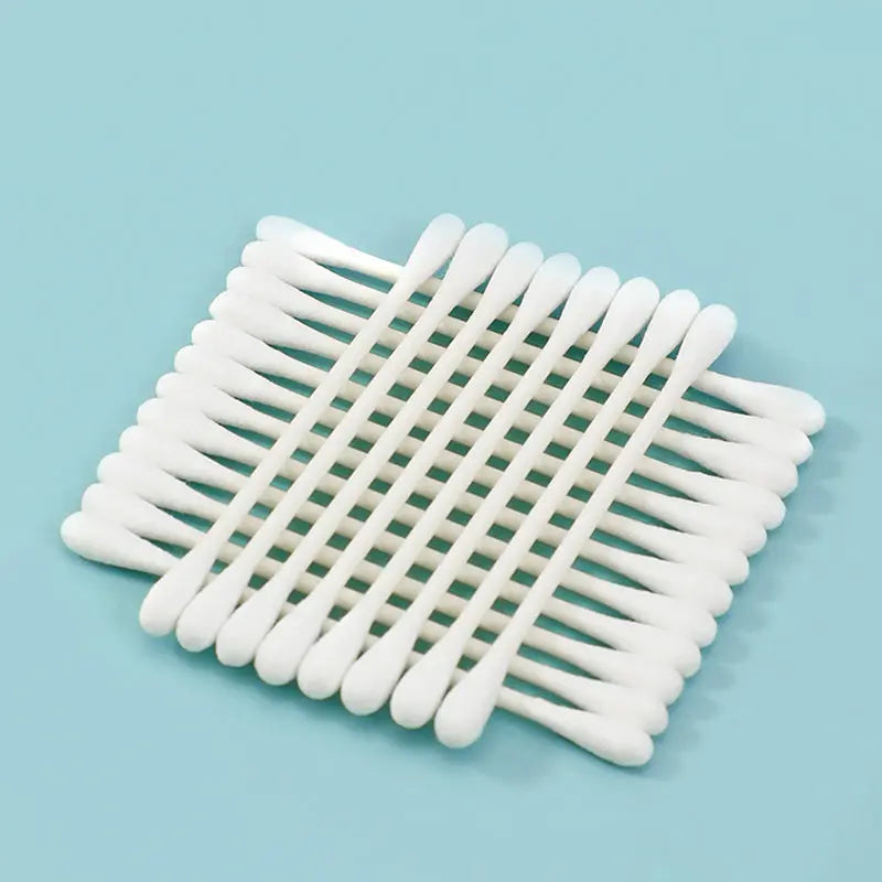 Close-up of lint-free pure cotton buds with sturdy wooden sticks for daily care