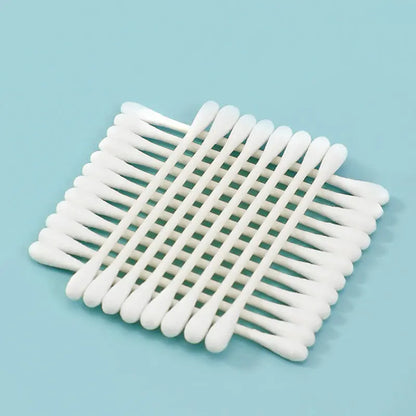 Close-up of lint-free pure cotton buds with sturdy wooden sticks for daily care