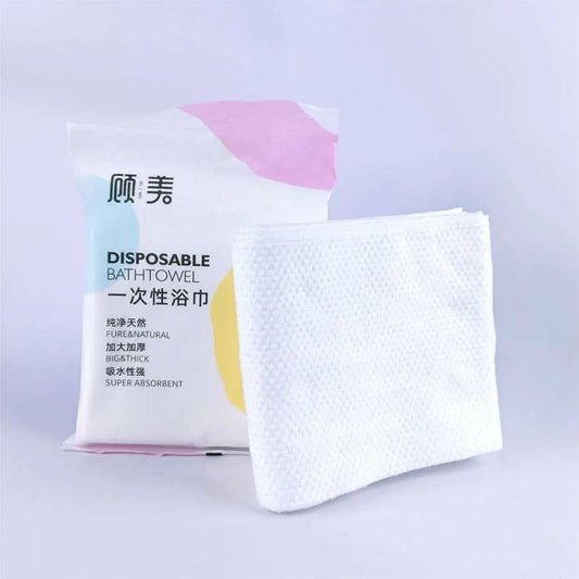 Premium 70x140cm disposable pure cotton bath towels for luxury hotels and spas, bulk produced by Little Cotton OEM facility.