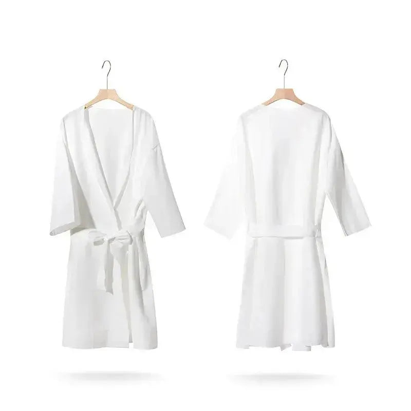 Premium disposable nonwoven robes for luxury hotels and spas, opaque and breathable, manufactured by Little Cotton B2B facility.