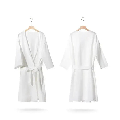 Premium disposable nonwoven robes for luxury hotels and spas, opaque and breathable, manufactured by Little Cotton B2B facility.