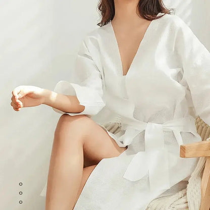 Premium disposable nonwoven robes for luxury hotels and spas, opaque and breathable, manufactured by Little Cotton B2B facility.