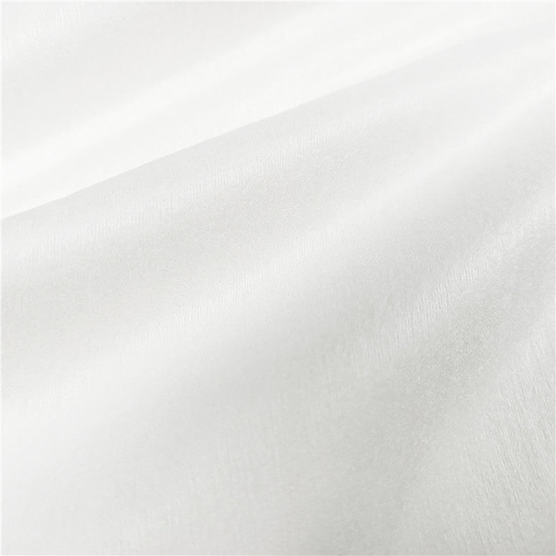 Close-up of premium tri-layer spunlace nonwoven material for wet wipes converting